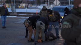 Protester detained during protest against ICE activities in Minneapolis