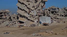 Palestinian family shelters in damaged Khan Younis building