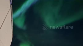 Iceland: Massive Northern Lights Illuminate Night Sky Over Reykjavík