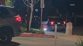 US, Los Angeles: East Hollywood Coco Robot Nearly Collides With Group Of LAPD Officers