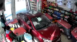 Terrifying moment out-of-control sends stone ball crashing into Chinese restaurant