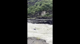 Kayaker going airborne on the Zambezi river