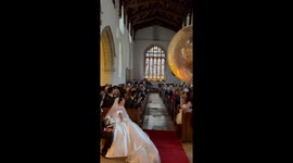 Bride and groom stuns guests with surprise brass band as entire church sings '12 Days of Christmas' at wedding