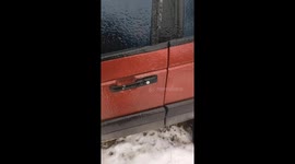 Frozen car door handle snaps in extreme cold in Pyatigory, Russia