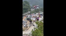 Rescuer helps girl stuck in the middle of cycling zip line