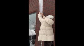 Man avoids injury after accidentally breaking off massive icicle in viral Moscow clip