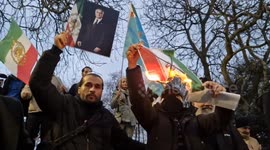 Pictures of the Ayatollah burn in London as protesters call for regime change
