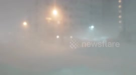 Japan: Blizzard Conditions Reduce Visibility in Sapporo