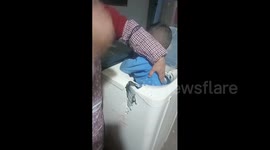 China: Chinese child gets trapped in washing machine and family breaks it open to rescue him