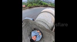 China: Chinese man enters concrete mixer tank in first person view to clear heavy debris