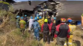 Firemen battle to reach bodies trapped inside Thailand train wreckage