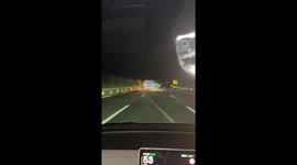 Chinese men save trapped truck driver after rollover accident on highway