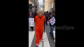 US: Protester Wears Trump Mask During Anti-ICE Protest in New York