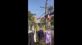 Moment crane wreckage plunges onto crashed train in Thailand