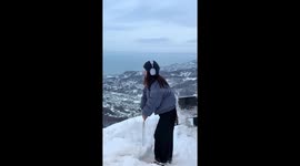 Snow photo goes wrong when umbrella unloads onto girl's face
