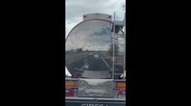 Car Winks At Itself In Truck's Reflection