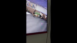 Gymnast pulls pants up mid backflip after they fell down during routine