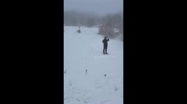 Man accidentally bumps friend while sliding on snow in Leinster, Ireland