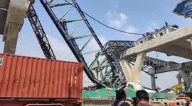 Crane collapses onto road killing two drivers a day after near-identical crash onto train