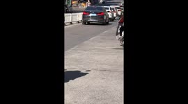 Large rolling stone surprises stopped traffic on highway in Fujian, China