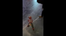 Dog enjoys a playful nighttime run on frozen ground in Heilongjiang, China