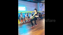 China: Roller-skating coach performs dramatic backbend slide in China