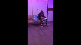 Passenger chills with his pet pigeon at train station in London