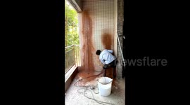 Construction workers narrowly avoids being cut in half after losing control of electric saw