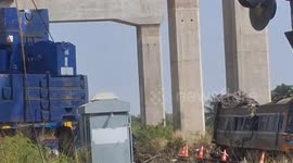 Mourning families say prayers for relatives killed when crane fell on train carriages