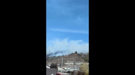 Smoke from mountain fires shrouds homes in Uenohara, Japan