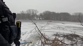 US: Police Officers Rescue Fisherman From Icy Death On Frozen Lake
