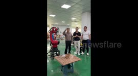 China: Gesture-controlled spray-painting robot impresses Chinese visitors