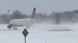 Delta Air Lines Boeing 717 snow blast in Rochester International Airport, USA