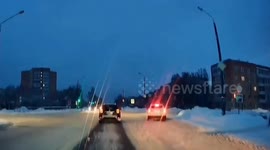 Car overturns after skidding into snowdrift on Silkina Street in Sarov, Russia