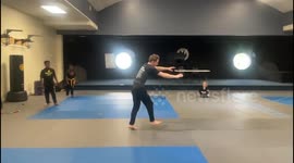 Gravity-Defying Backflip: Superhero Landing in Intense Martial Arts Training!