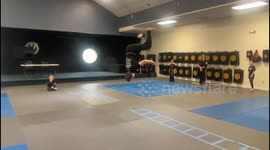 Gravity-Defying Backflip: Superhero Landing in Intense Martial Arts Training!