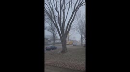 Snow squall reduces visibility during evening in Independence, Missouri, USA