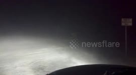 Worsening blizzard conditions reduce visibility in Grand Forks, North Dakota, USA