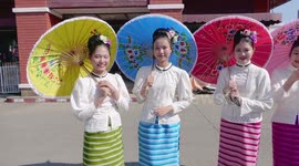Thai Beauty Contestants Riding Bicycles While Holding Umbrellas in Bo Sang, Chiang Mai