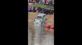 Chinese residents worked together in a touching effort to recover a car from a river