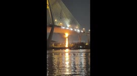 Fire erupts on drainage pipes under bridge in Thailand