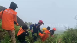 Plane debris recovered from remote crash site on mountain in Indonesia