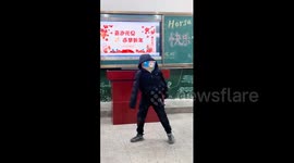China: Chinese student uses textbooks to perform face changing at school celebration