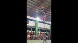 Unicycle rider shows off his impressive skills on basketball court