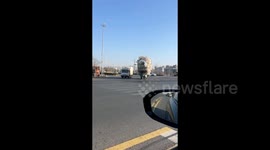 Shocked driver films tricycle pilled with more than 10ft high with 1,000s of plastic bottles