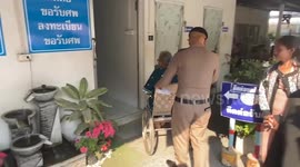 Wife of German train crash victim breaks down in tears as she collects her husband's body