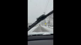 Driver battles through snow storm in New Jersey