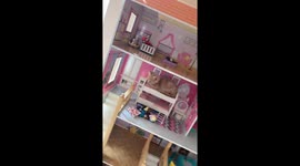 Kitten In The Dollhouse Bed