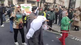 UK, London: Faces Of Defiance Mark Free Iran Rally In Central London