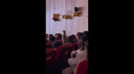 Meerkat in China stood among the audience and watched a public performance